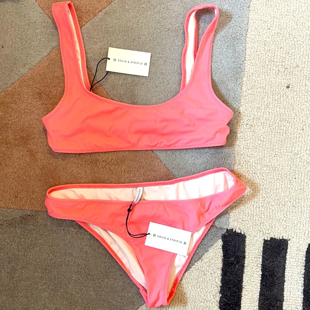 Brand new with tags solid and striped bikini. Medium top large bottom.